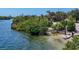 A kayak sits on the shore near a mangrove-lined waterway at 312 Yacht Harbor Dr, Osprey, FL 34229