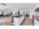 Open kitchen with a large island, modern appliances, and seamless access to the living area at 312 Yacht Harbor Dr, Osprey, FL 34229