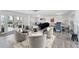 Bright and airy living room featuring stylish furnishings, open floor plan, and water view access at 312 Yacht Harbor Dr, Osprey, FL 34229