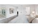 Bright main bedroom features a view of the ensuite bathroom and a large window, with hardwood floors at 312 Yacht Harbor Dr, Osprey, FL 34229