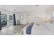 A view of the bright, spacious main bedroom, with patio doors, an area rug, and crisp white trim at 312 Yacht Harbor Dr, Osprey, FL 34229