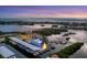 Aerial view of a marina at sunset, showcasing boats and the waterfront at 312 Yacht Harbor Dr, Osprey, FL 34229