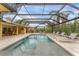 Stunning screened pool area with comfortable lounge chairs and beautiful views, perfect for relaxation at 312 Yacht Harbor Dr, Osprey, FL 34229