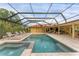 Spacious pool and patio with covered seating area at 312 Yacht Harbor Dr, Osprey, FL 34229