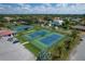 Aerial view of community tennis and pickleball courts at 312 Yacht Harbor Dr, Osprey, FL 34229