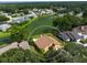 Bird's eye view of a house near a lake in a residential area at 3888 Shady Brook Ln, Sarasota, FL 34243