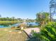 Backyard oasis with pond views and brick patio at 3888 Shady Brook Ln, Sarasota, FL 34243