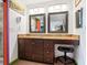 Double vanity bathroom with granite countertops and large mirrors at 3888 Shady Brook Ln, Sarasota, FL 34243