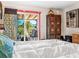 Bright bedroom with a king-size bed and picturesque patio access at 3888 Shady Brook Ln, Sarasota, FL 34243