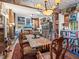 Charming dining room with a rustic wooden table and unique decor at 3888 Shady Brook Ln, Sarasota, FL 34243