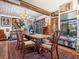 Eclectic dining room with rustic wooden table and unique decor at 3888 Shady Brook Ln, Sarasota, FL 34243