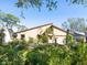 Unique home exterior with lush landscaping at 3888 Shady Brook Ln, Sarasota, FL 34243