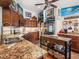 Granite kitchen island and stainless steel appliances at 3888 Shady Brook Ln, Sarasota, FL 34243