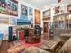 Living room with eclectic decor and a large TV at 3888 Shady Brook Ln, Sarasota, FL 34243