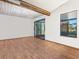 Living room features wood floors, slider doors, and a decorative ceiling at 3888 Shady Brook Ln, Sarasota, FL 34243