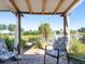 Brick patio with comfortable seating and lake views at 3888 Shady Brook Ln, Sarasota, FL 34243
