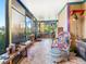 Spacious sunroom showcasing unique decor and stunning lake views at 3888 Shady Brook Ln, Sarasota, FL 34243