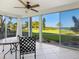 Bright sunroom with water views and sliding glass doors at 4440 Exeter Dr # 104, Longboat Key, FL 34228