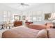 Bright bedroom with two beds, a desk, and plenty of light at 4451 Legacy Ct, Sarasota, FL 34241