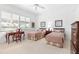 Spacious bedroom with two twin beds and window seating at 4451 Legacy Ct, Sarasota, FL 34241