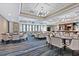 Elegant clubhouse dining room with tables, chairs, and a bar at 4451 Legacy Ct, Sarasota, FL 34241
