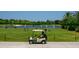 Golf driving range with golfers practicing their swing at 4451 Legacy Ct, Sarasota, FL 34241