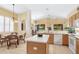 Open kitchen with island, breakfast nook, and view to living room at 4451 Legacy Ct, Sarasota, FL 34241