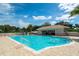 Resort-style pool with a large sundeck and cabana at 4451 Legacy Ct, Sarasota, FL 34241
