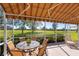 Sunroom with glass-top table and chairs, overlooking the golf course at 4451 Legacy Ct, Sarasota, FL 34241