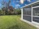 The screened lanai has a well-manicured lawn with mature trees for ultimate privacy and peaceful outdoor living at 4514 Sanibel Way, Bradenton, FL 34203