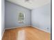 Bedroom with a vaulted ceiling, light wood floors and a window at 4514 Sanibel Way, Bradenton, FL 34203