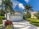 One-story house with white garage door and landscaped yard at 4514 Sanibel Way, Bradenton, FL 34203