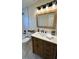 Updated bathroom features a modern vanity and a large mirror at 460 Creek Lane Dr, Englewood, FL 34223