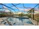 Relaxing pool and spa area with screened enclosure, offering sunset views at 4714 Zeno Ct, Bradenton, FL 34211