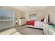 Cozy bedroom with a full-size bed and white dresser at 4762 Meredith Ln, Sarasota, FL 34241