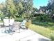 Relaxing patio with seating area overlooking a spacious backyard at 5200 Highbury Cir, Sarasota, FL 34238