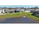Aerial view showcasing a home with a backyard backing up to a lake at 6107 116Th E Ave, Parrish, FL 34219
