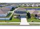 Two-story house with gray siding, located in a quiet residential neighborhood near a lake at 6107 116Th E Ave, Parrish, FL 34219