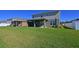 Spacious backyard with two-story home and pond view at 6107 116Th E Ave, Parrish, FL 34219