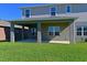 Home's backyard patio, partially covered at 6107 116Th E Ave, Parrish, FL 34219