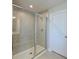 Clean bathroom with a walk-in shower and tiled flooring at 6107 116Th E Ave, Parrish, FL 34219