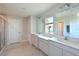 Elegant bathroom with double vanity and a walk-in shower at 6107 116Th E Ave, Parrish, FL 34219
