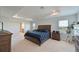 Spacious bedroom with wood bed frame and large windows at 6107 116Th E Ave, Parrish, FL 34219