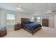 Bright bedroom featuring a wood bed frame and window views at 6107 116Th E Ave, Parrish, FL 34219