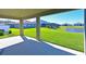 Covered patio with view of backyard and pond at 6107 116Th E Ave, Parrish, FL 34219
