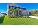 Two-story home with palm trees, well-manicured lawn, and attached garage at 6107 116Th E Ave, Parrish, FL 34219