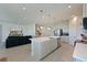 Modern kitchen with a large island, stainless steel appliances, and white cabinets at 6107 116Th E Ave, Parrish, FL 34219