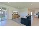 Living room with comfortable seating, large TV and backyard access at 6107 116Th E Ave, Parrish, FL 34219