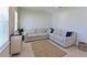 Bright living room with large windows, sectional sofa, and area rug at 6107 116Th E Ave, Parrish, FL 34219