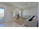Spacious living room with a large sectional sofa and neutral color scheme at 6107 116Th E Ave, Parrish, FL 34219